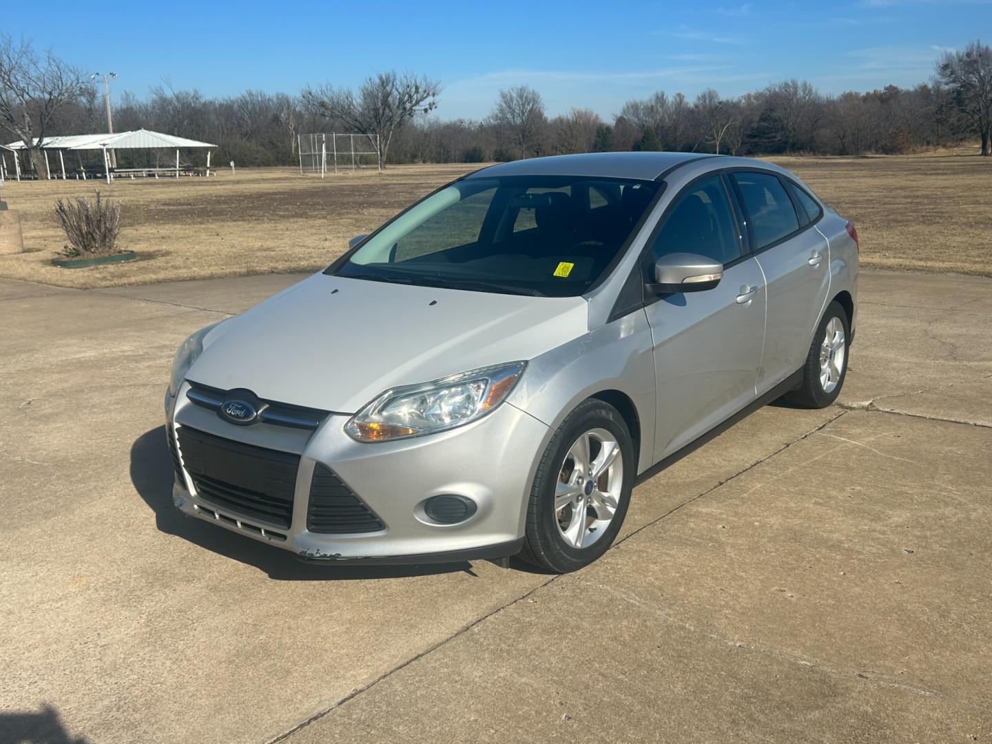 2013 Silver /Gray Ford Focus SEL FWD (1FADP3F2XDL) with an 2.4L engine, AUTOMATIC transmission, located at 17760 Hwy 62, Morris, OK, 74445, (918) 733-4887, 35.609104, -95.877060 - Photo#0